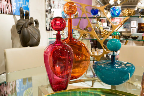 Bottles, Buddha, and Brass